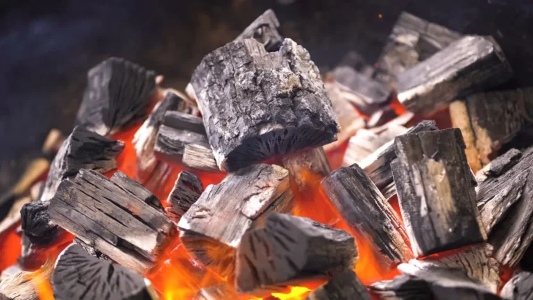 lumpwood charcoal burning on a fire