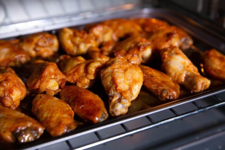 BBQ foods being reheated in the oven