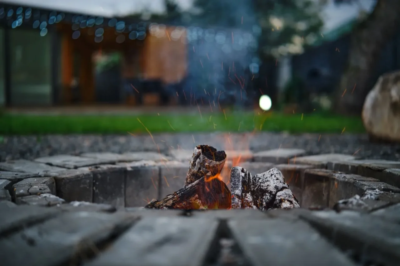 outdoor cosy fire pit with logs burning